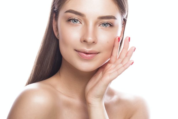 Beautiful young woman with a light natural make-up and perfect skin.