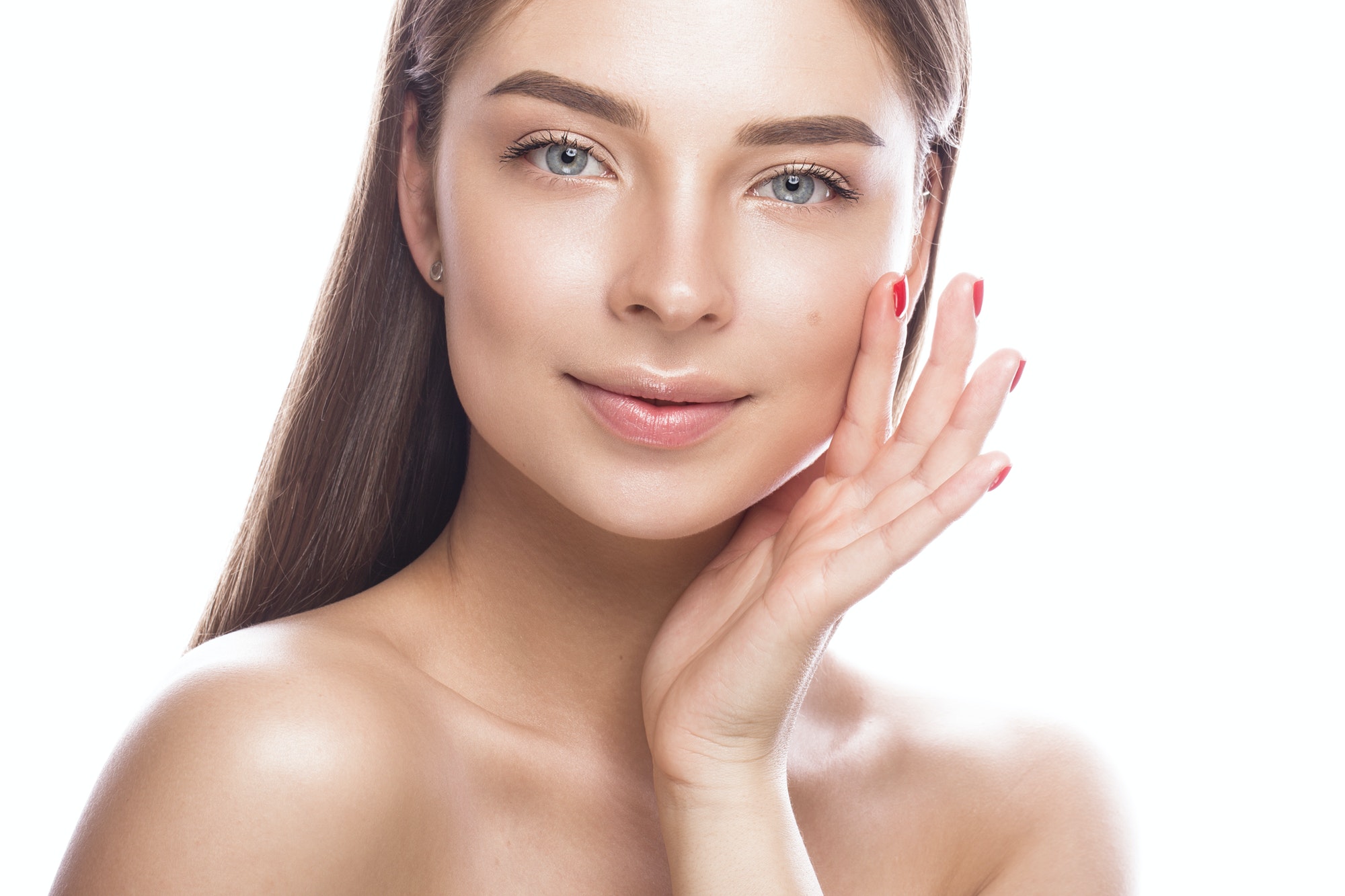 Beautiful young woman with a light natural make-up and perfect skin.