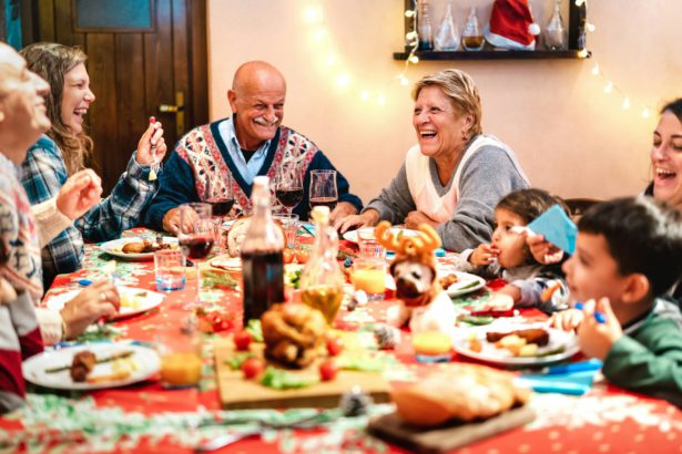 Multi generation family having fun at Christmas dinner event