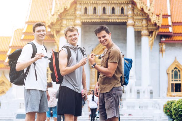 The best way to see Asia. Cheerful friends traveling and exploring city