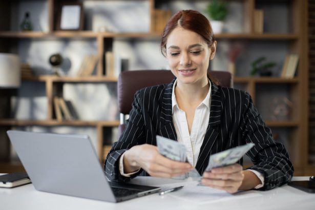 Woman counting money. Business investment.